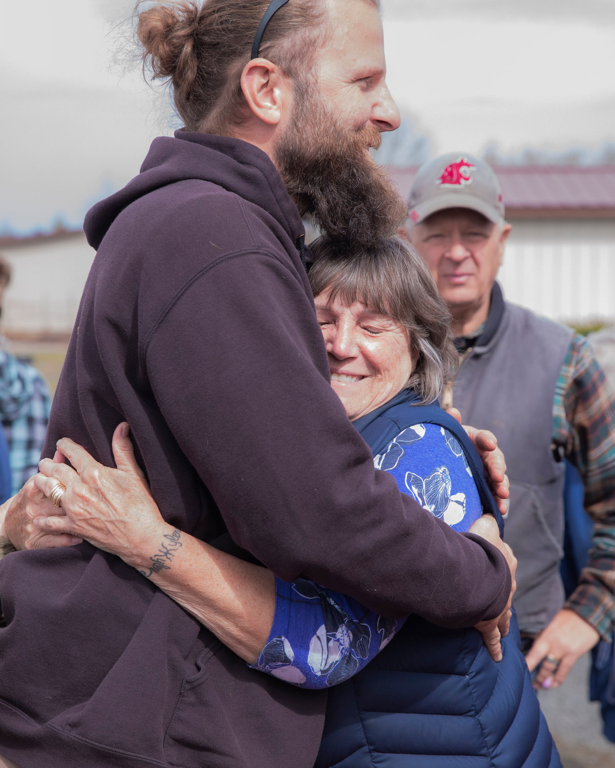 Connie Davis and Kyle Aselton smile and hug after a ribbon cutting ceremony for Dirty Thumb Nursery in Adna on Tuesday, March 28, 2023.