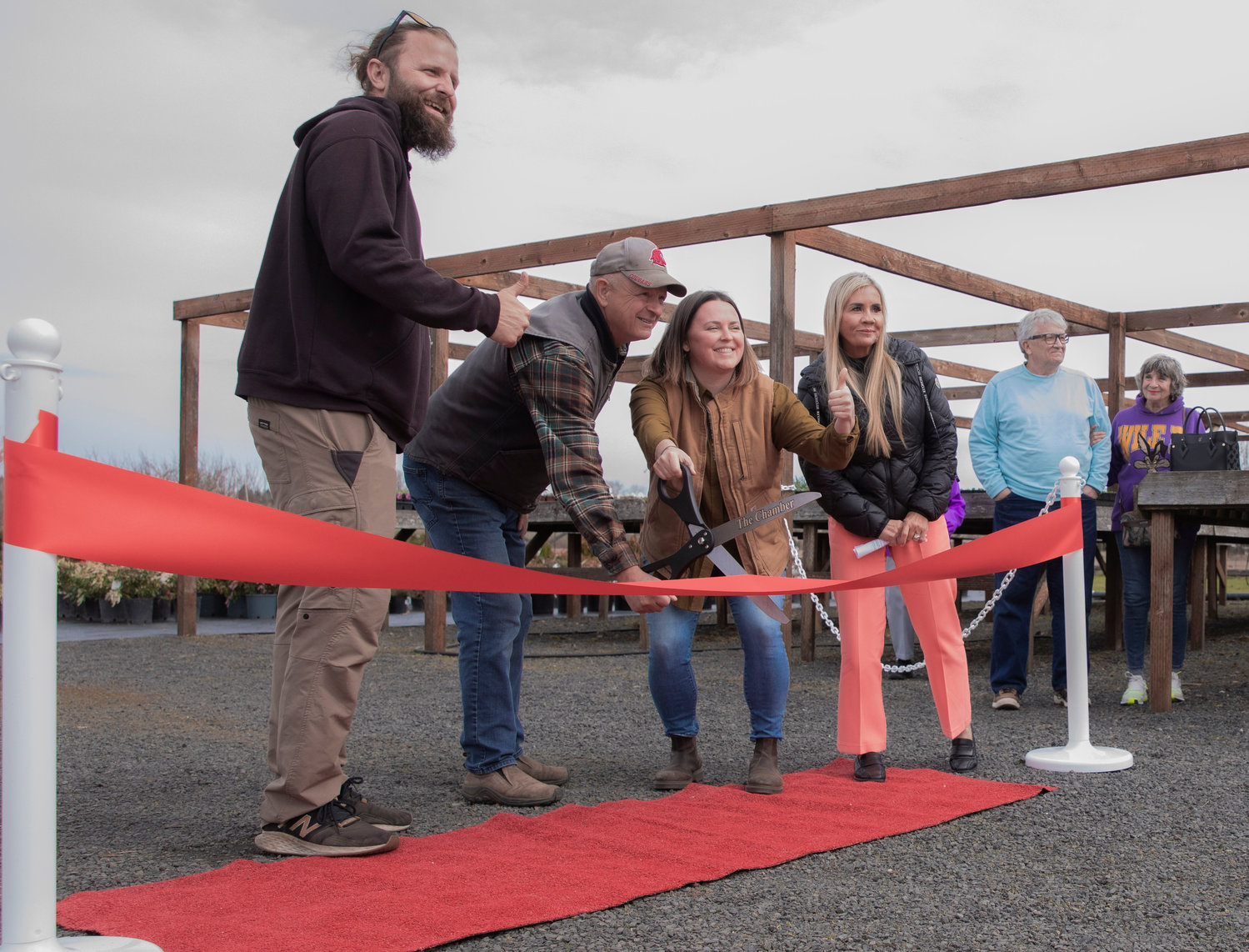 Kyle Aselton, Spencer Davis, Jena Aselton and Coralee Taylor pose for a photo during a Centralia-Chehalis Chamber of Commerce ribbon cutting ceremony for Dirty Thumb Nursery in Adna on Tuesday, March 28, 2023.