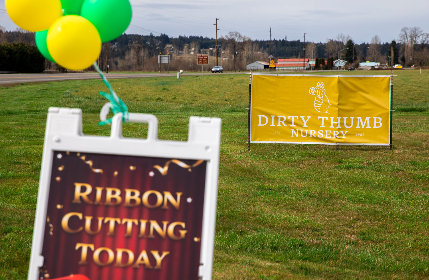 Signs sit on display for a Centralia-Chehalis Chamber of Commerce ribbon cutting ceremony for Dirty Thumb Nursery in Adna on Tuesday, March 28, 2023.