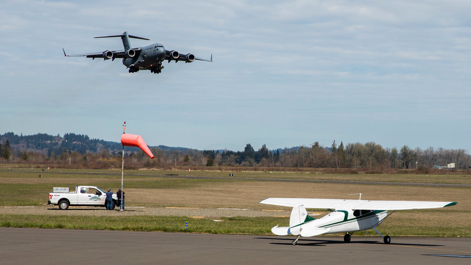 A C-17 comes in for a low flyover at the Chehalis-Centralia Airport Wednesday afternoon in Chehalis.