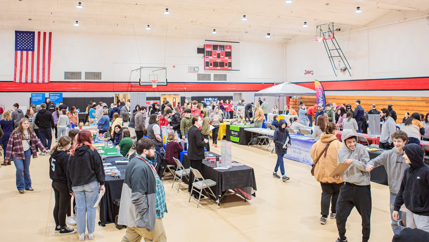 Students walk through Tenino High School’s college and career fair in the gymnasium Thursday morning.