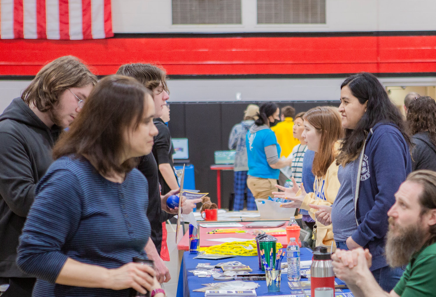 Students speak with recruiters and educators during a college and career fair at Tenino High School Thursday.