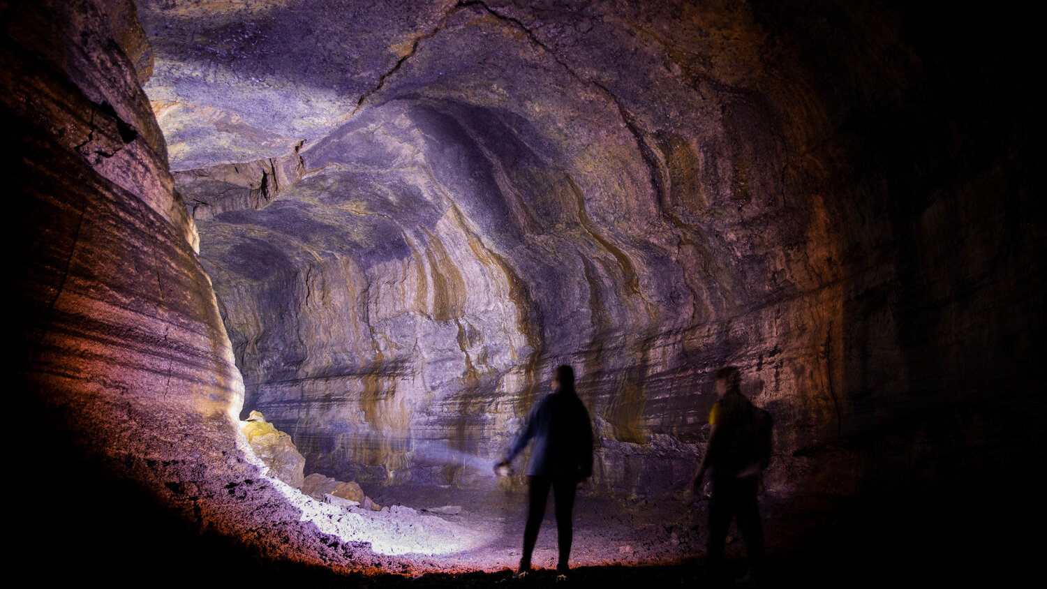 A flashlight illuminates the Ape Cave in Cougar on opening day Thursday, May 18.