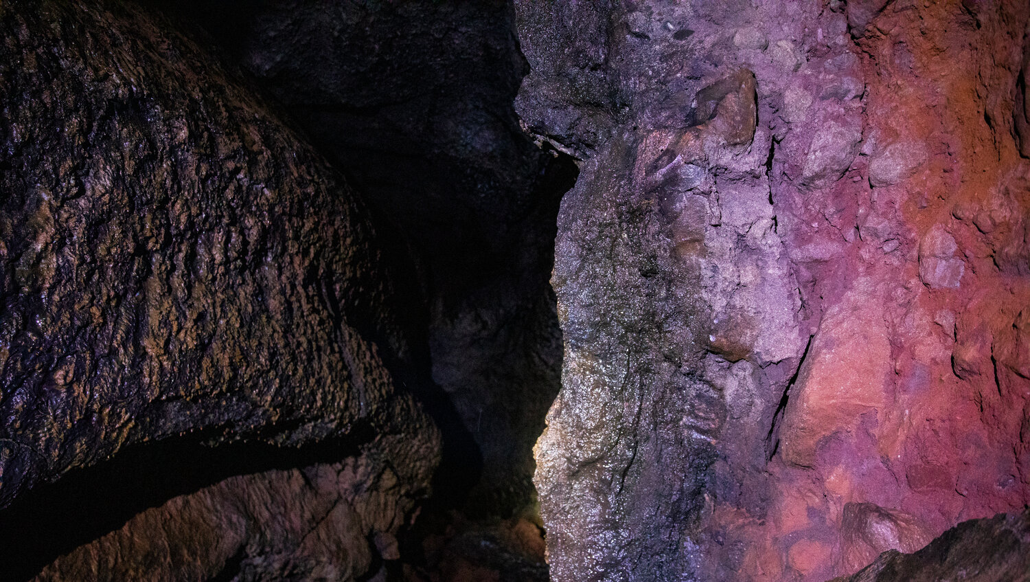 Rocks illuminate with color at the Ape Cave in Cougar on opening day Thursday, May 18.