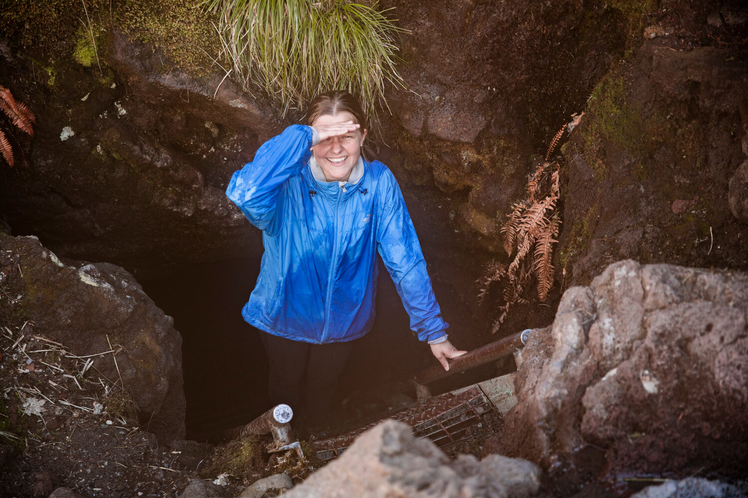 Assistant Editor Isabel Vander Stoep smiles as she reaches the surface at the upper entrance to the Ape Cave in Cougar on opening day Thursday, May 18.