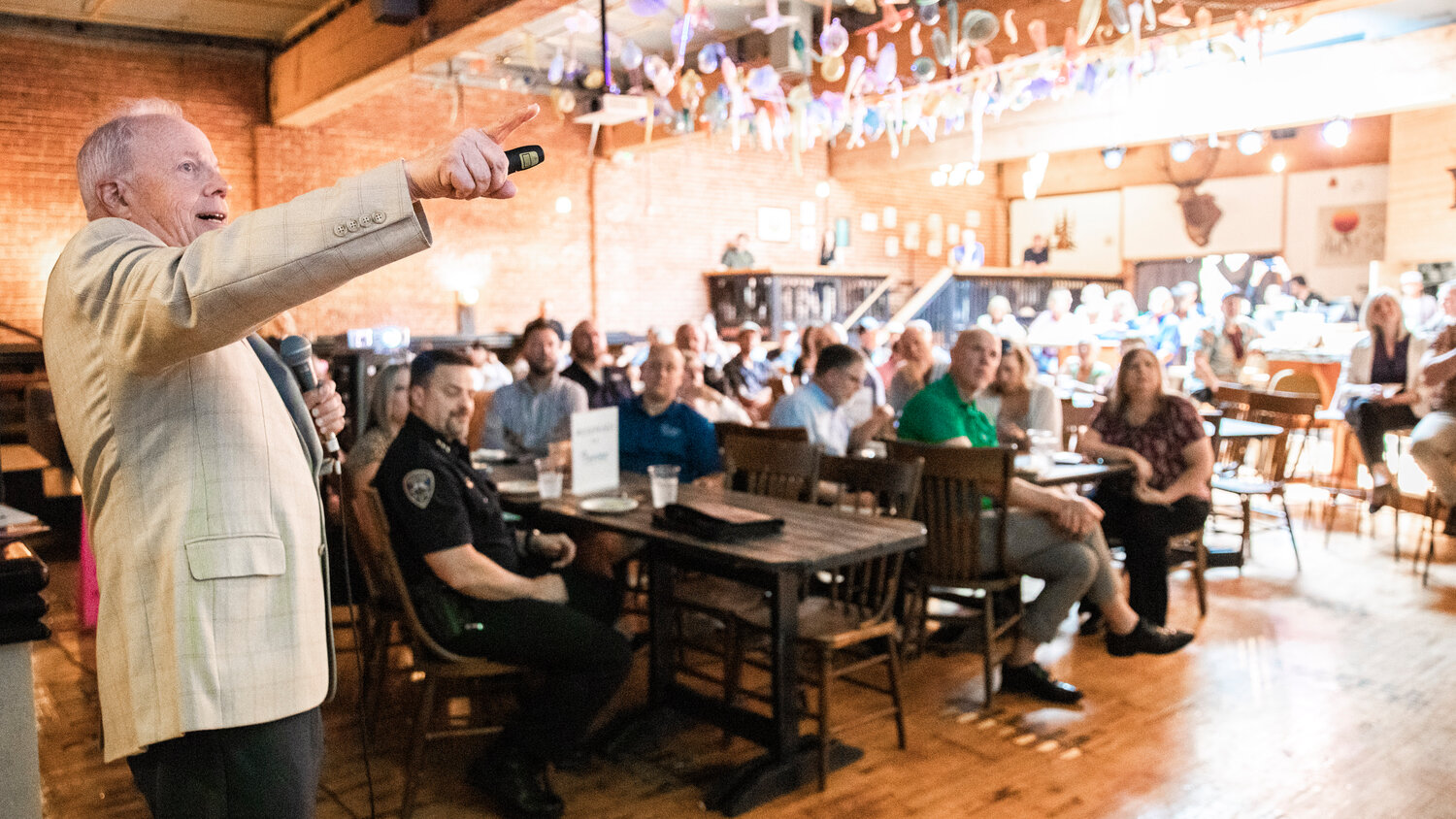 Dr. Bill Conerly points to a presentation while giving an economic forecast for Lewis County during an event hosted by the Economic Alliance of Lewis County at The Juice Box in Centralia on Wednesday, May 17.