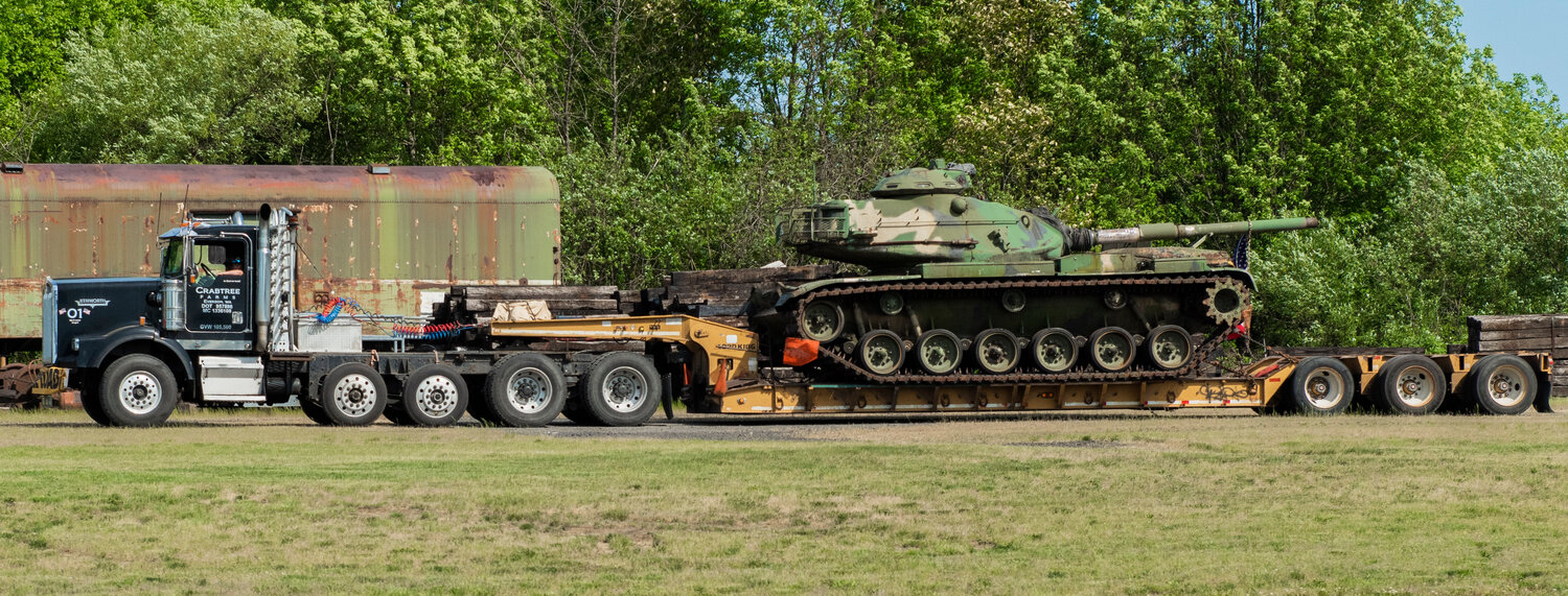 A M60 tank is hauled to the Veterans Memorial Museum in Chehalis on Saturday, May 20. The Lynden Historical Museum, from which it came, had no scope for the piece and it fits nicely into the local collection, according to Museum Director Chip Duncan.