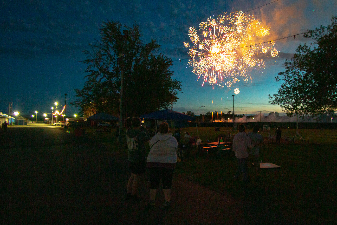 A fireworks display is seen Saturday night at the Southwest Washington Fairgrounds while attendees of the American Cancer Society's Relay for Life watch.