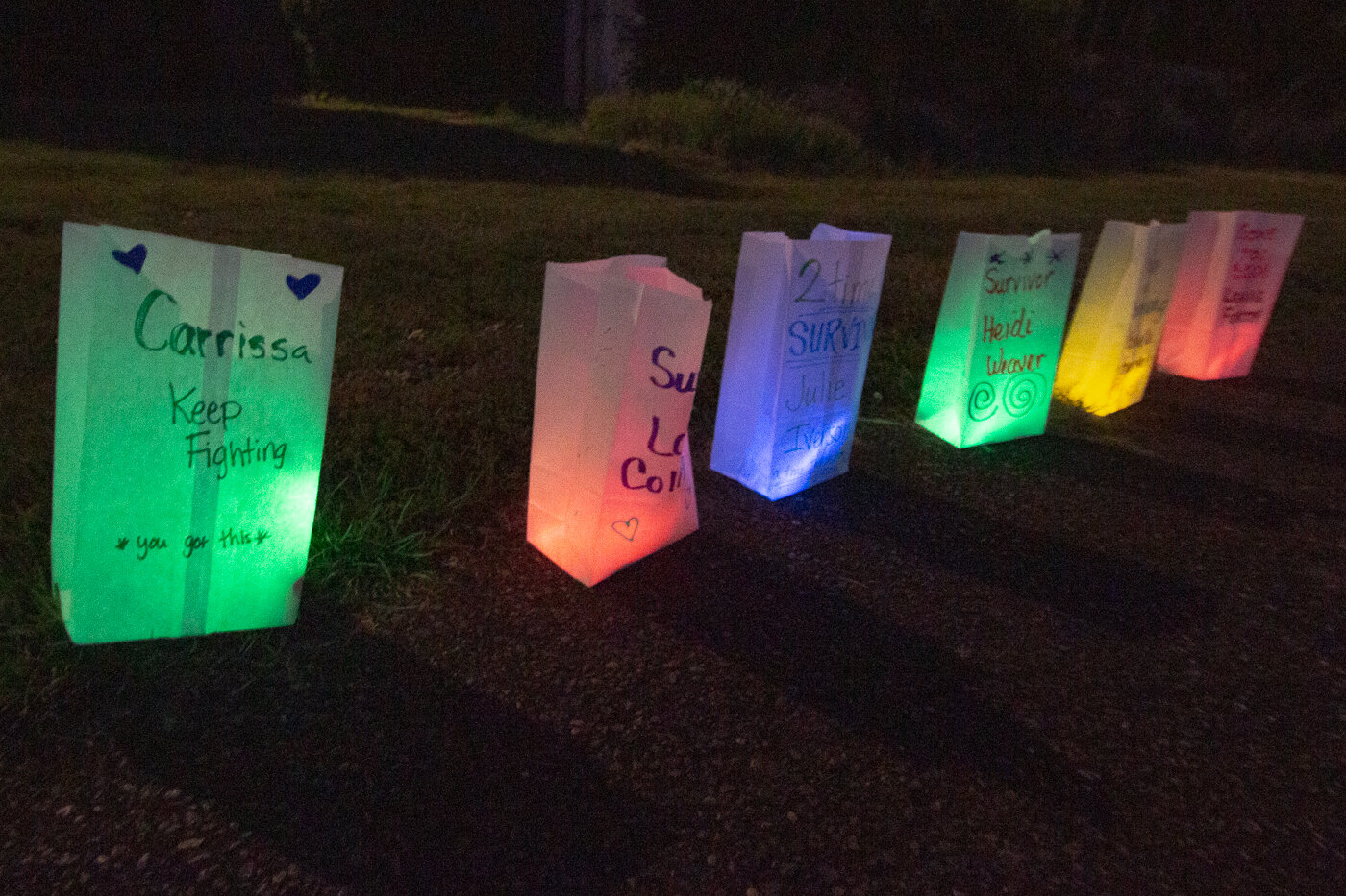 Lumnaria are seen at the Southwest Washington Fairgrounds Saturday night at the Relay for Life. Each one was dedicated to someone who survived cancer, is currently fighting cancer or had lost the fight.