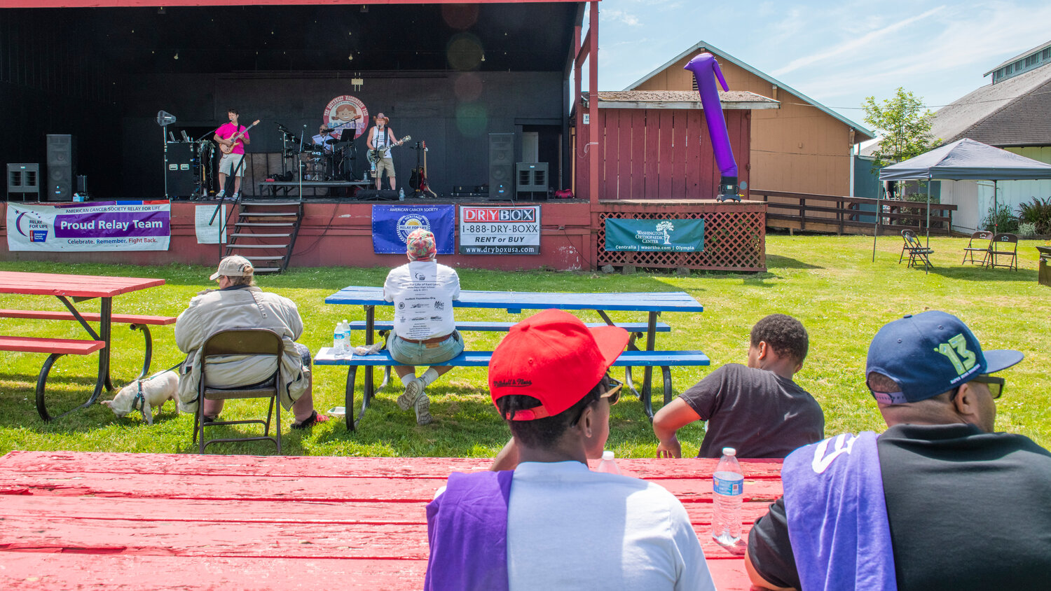The Backfire Band performs during a Relay For Life survivor walk at the Southwest Washington Fairgrounds on Saturday, May 20.