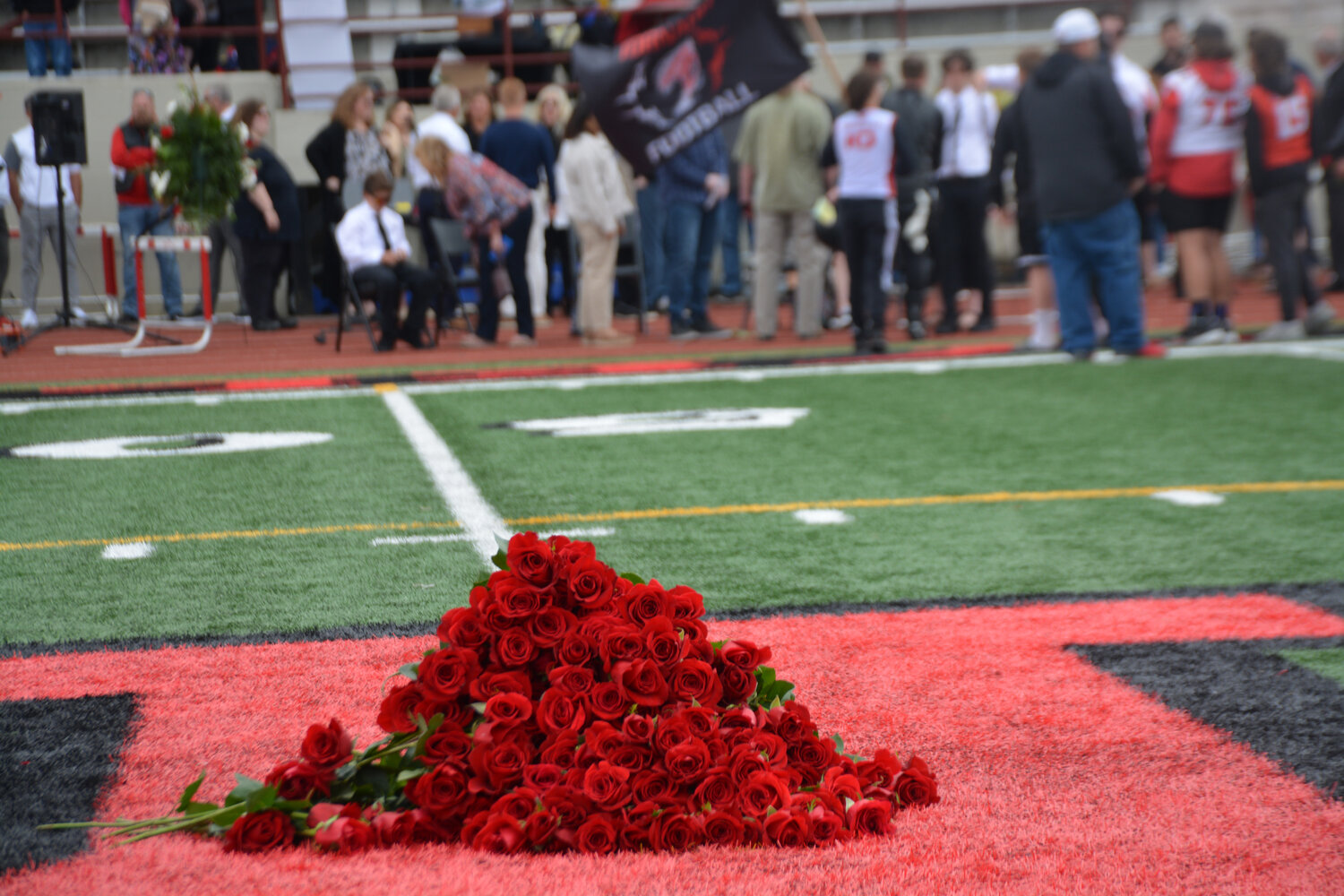 Roses sat mid-field on Yelm High School’s football field in memory of Shawn Jemtegaard.