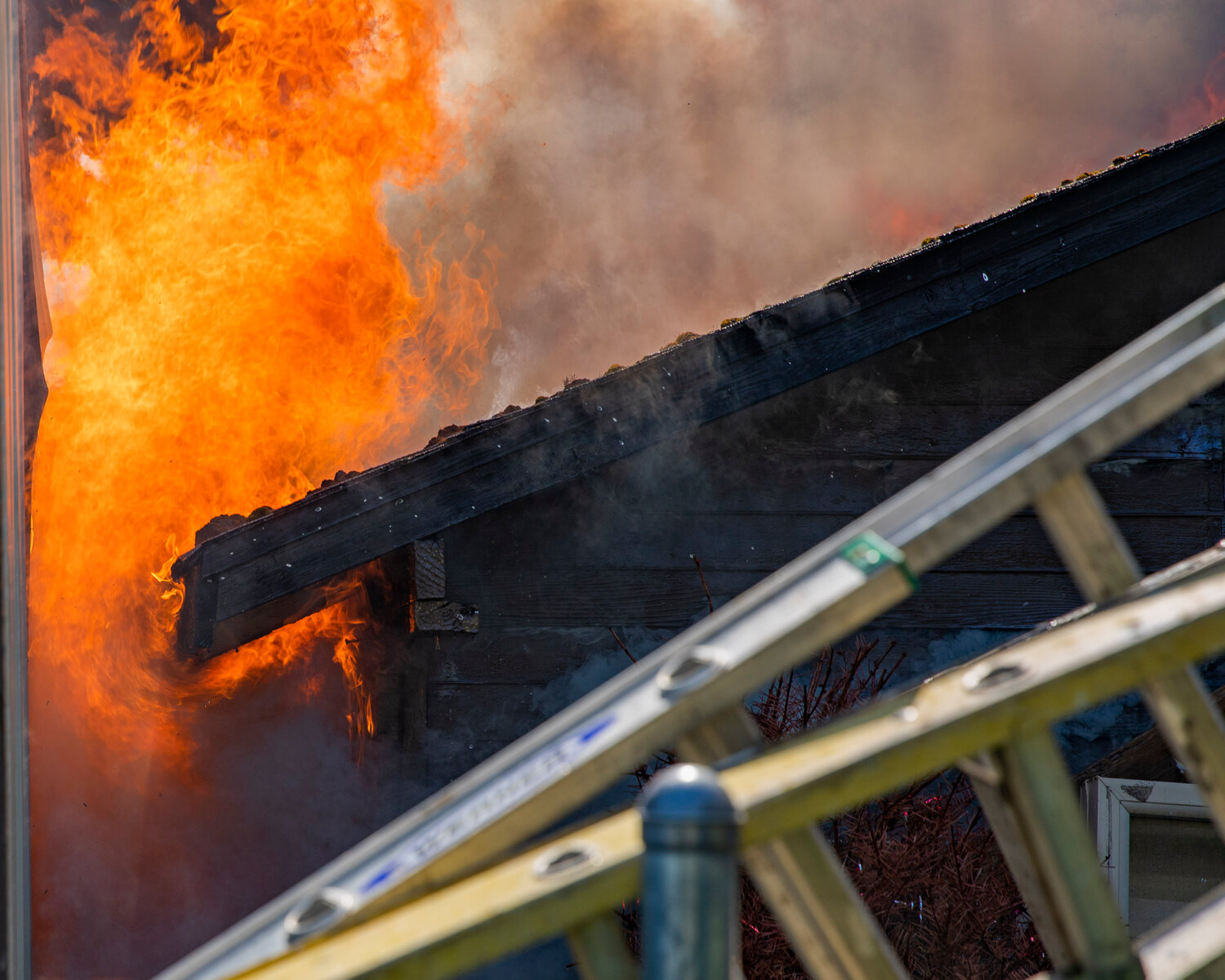 Flames roll through a structure in the 800 block of Centralia College Blvd. on Wednesday, May 24.
