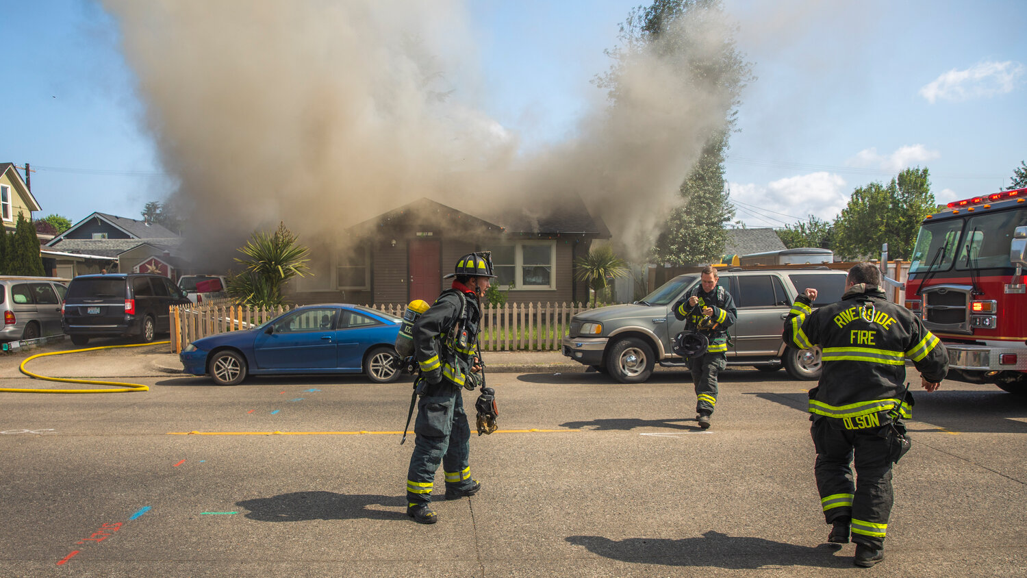 First responders from Riverside Fire Authority arrive on scene as a column of smoke rises from a residence in the 800 block of Centralia College Blvd. on Wednesday, May 24.