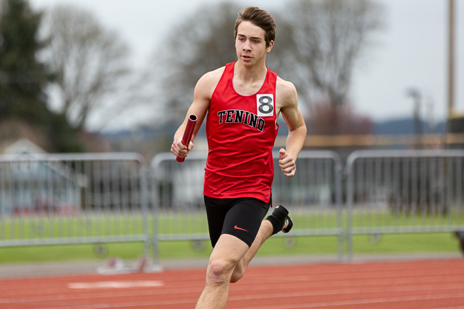 Tenino 4x400-meter relay runner Blaine Schott takes off toward the curve at the Chehalis Activators Classic April 22 at W.F. West.