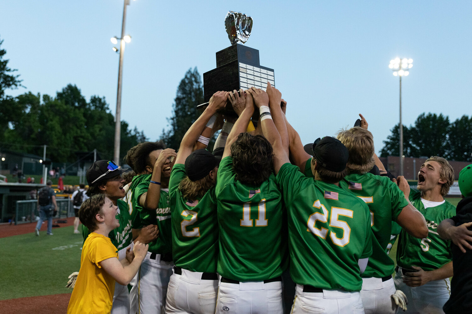 The Tumwater baseball team holds the first-place trophy after a 2-1 win in the 2A state title against Lynden at Joe Martin Stadium in Bellingham May 27.