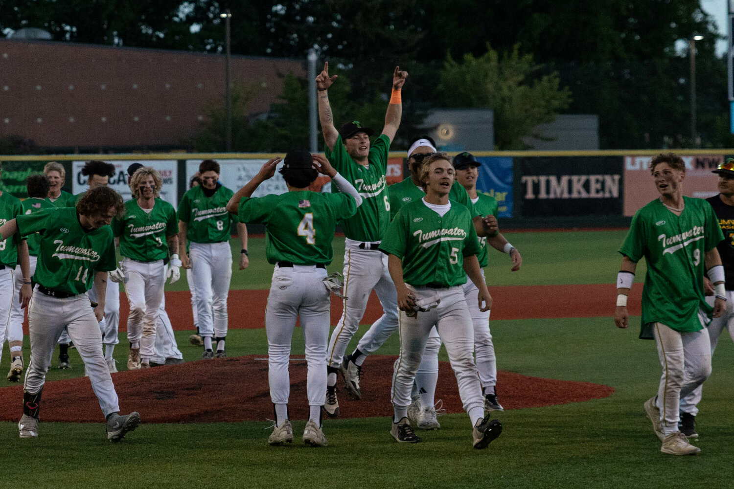 The Tumwater baseball team yells in celebration after a 2-1 win in the 2A state title against Lynden at Joe Martin Stadium in Bellingham May 27.