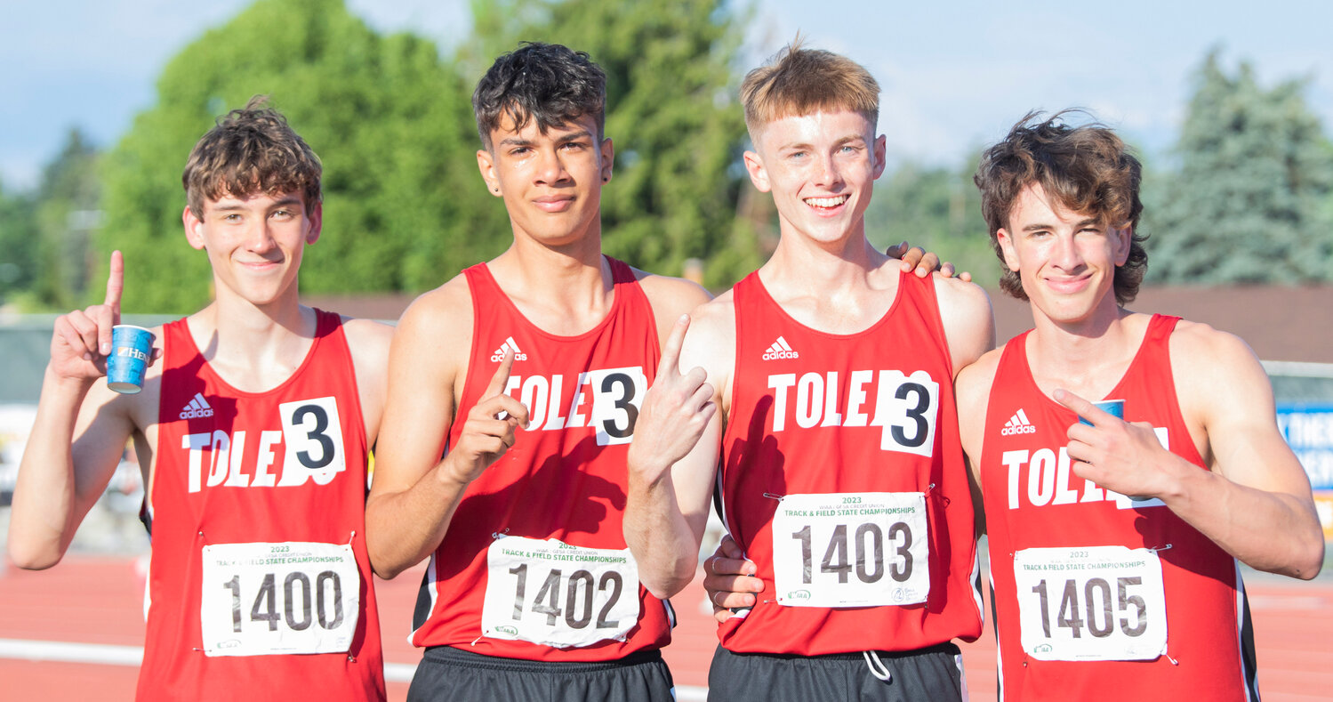 From left, Toledo’s 4x400 relay team Trevin Gale, Jordan McKenzie, Conner Olmstead and John Rose smile for a photo together as tears stain their cheeks moments after winning the 2B State championship during the track and field meet in Yakima on Saturday.
