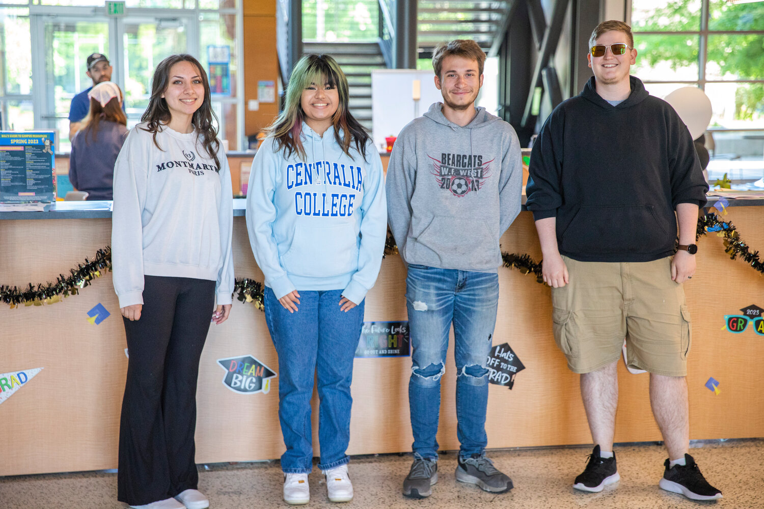 From left, current Centralia College employees and W.F. West graduates Passion Luna, Maya Ramirez, Jacob Moeckel and Asher Blair pose for a photo. In their roles with the college, they serve as de-facto counselors and advisors, helping students with  studies and time management — or just lending an ear to those who need it.