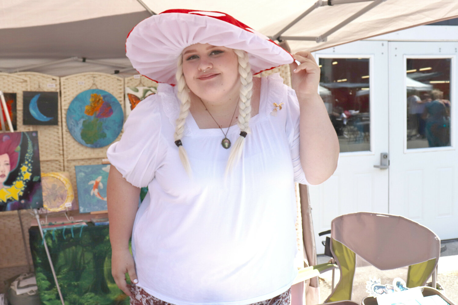 Rachel shows off her mushroom hat at the Southwest Washington Fairgrounds in Chehalis during the Centralia Fantasy Festival on Saturday, May 27.