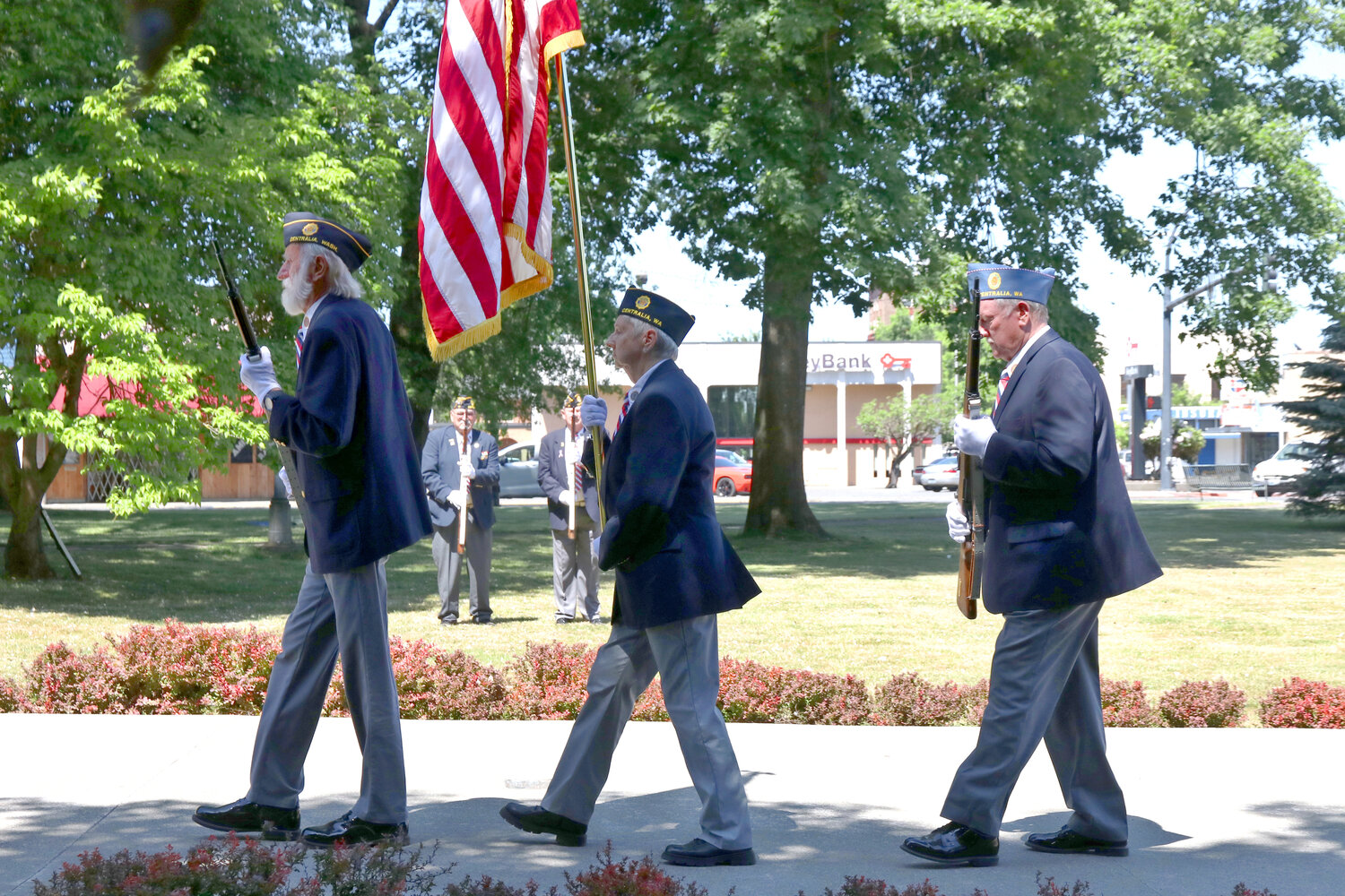 Members of American Legion Grant Hodge Post 217 stand during a Memorial Day ceremony at George Washington Park in Centralia Monday.