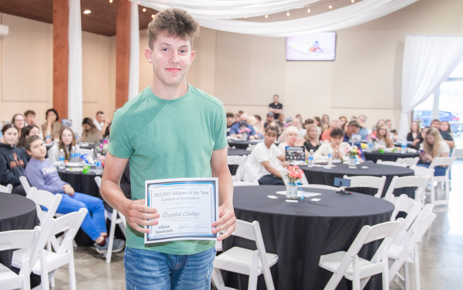 Adna’s Braeden Salme smiles for a photo Tuesday evening during the “Athletes of the Year” banquet at the Jester Auto Museum. Salme, a junior, took the 1B/2B District 4 individual title for golf before helping Adna place sixth as a team at the State level.