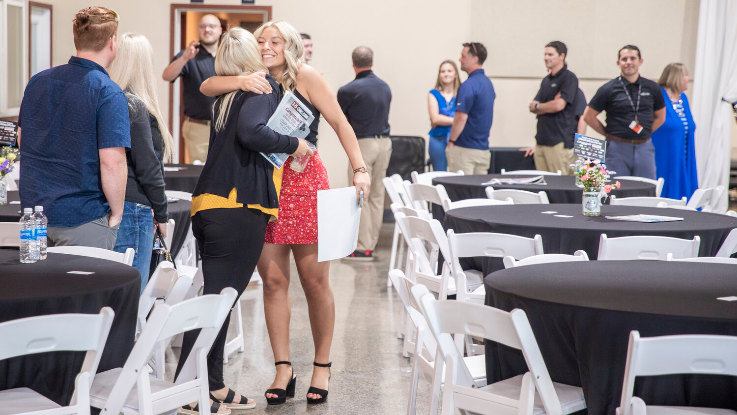 W.F. West’s Cameron Sheets smiles as she receives a hug Tuesday evening during the “Athletes of the Year” banquet at the Jester Auto Museum. Sheets was the 2A EvCo Offensive Player of the Year scoring 19 goals with 17 assists adding to the Bearcats’ 47 total goals on the season.