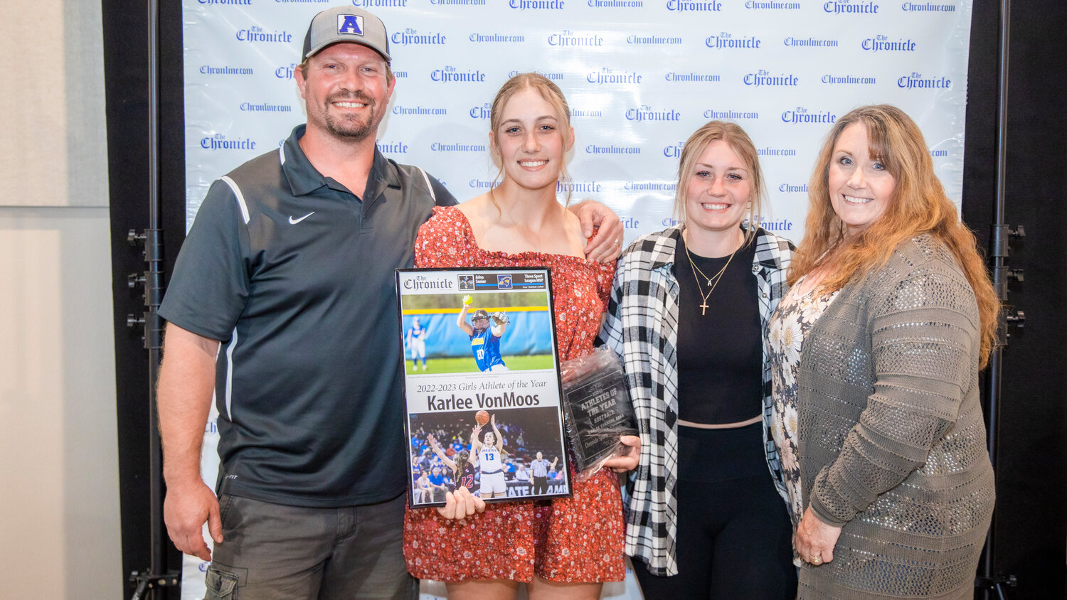 Adna’s Karlee VonMoos, a league MVP in each of the three sports she played this year, smiles for a photo with family Tuesday evening during the “Athletes of the Year” banquet at the Jester Auto Museum. VonMoos dominated the soccer pitch, basketball court and the softball diamond en route to one of the strongest all around sports careers in Adna.
