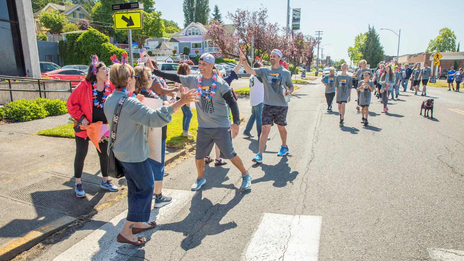 State Rep. Peter Abbarno and Commissioner Sean Swope participate in the Lewis County Special Olympics Law Enforcement Torch Run while greeting supporters outside outside Chehalis City Hall on Friday, June 2.