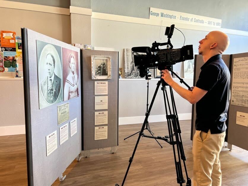 Jeff Axtman, creative services lead coordinator for KBTC Public Television, shoots B-roll at the George & Mary Jane Washington Museum, located in the Centralia Downtown Association office, on July 19, 2023. (Photo: Brian Mittge)