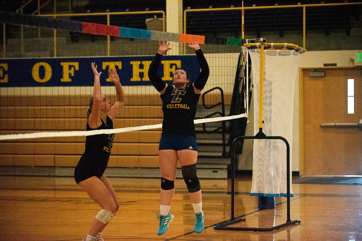 Katelyn Hunsaker prepares to set the ball while Morgan Rogerson prepares to block Morgan Rogerson leaps to spike the ball during the Centralia College volleyball team's practice on Aug. 9.