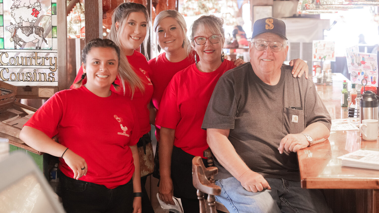 From left, Layla Lloyd and Sierra, Stephanie and Keeley Campbell smile for a photo with Fred Tereski inside Country Cousin in Centralia on Wednesday, Aug. 23. Tereski is a “bread and butter” regular at the establishment.