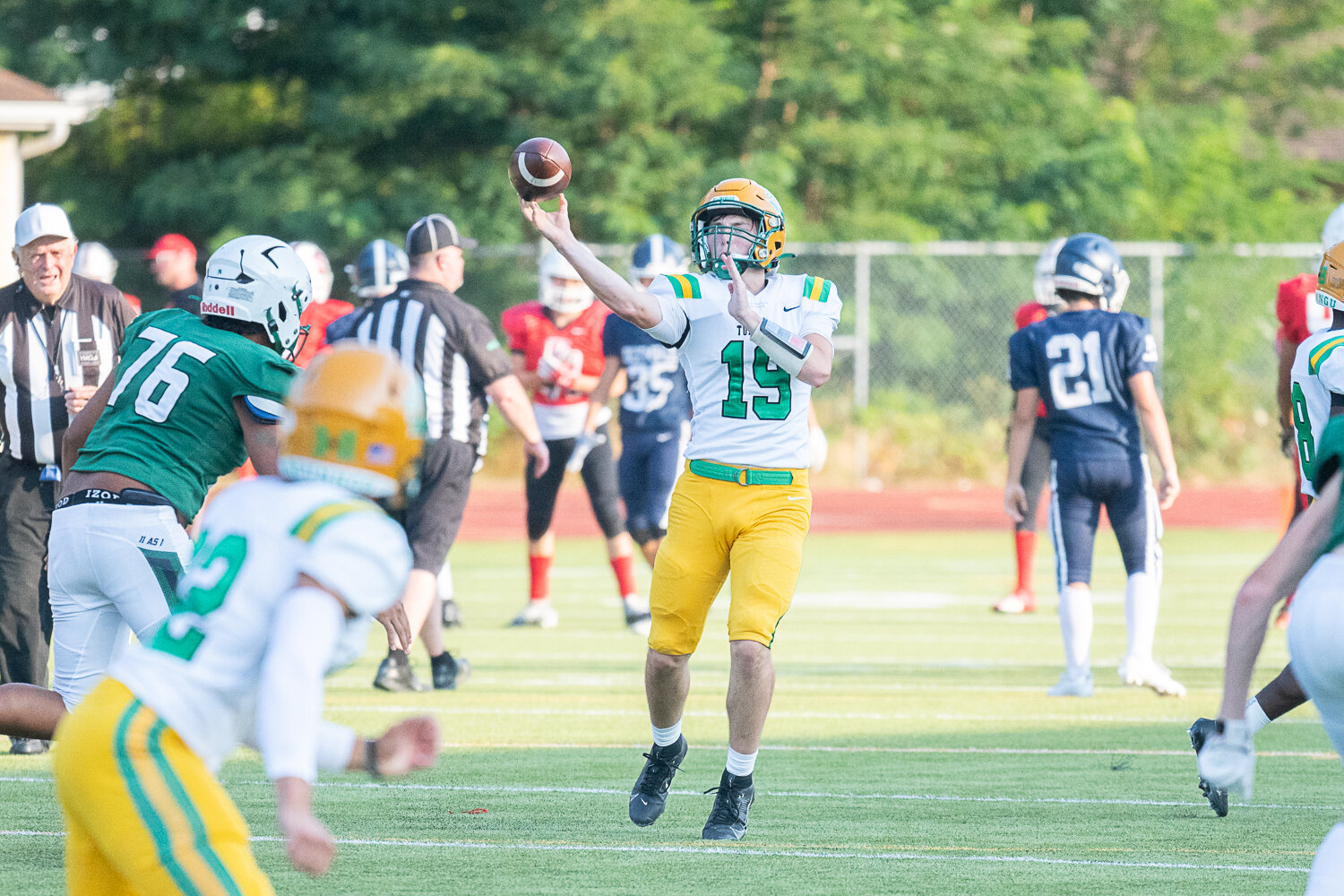 Ethan Kastner slings a pass downfield during Tumwater's jamboree matchup against Peninsula on Friday, Aug. 25.
