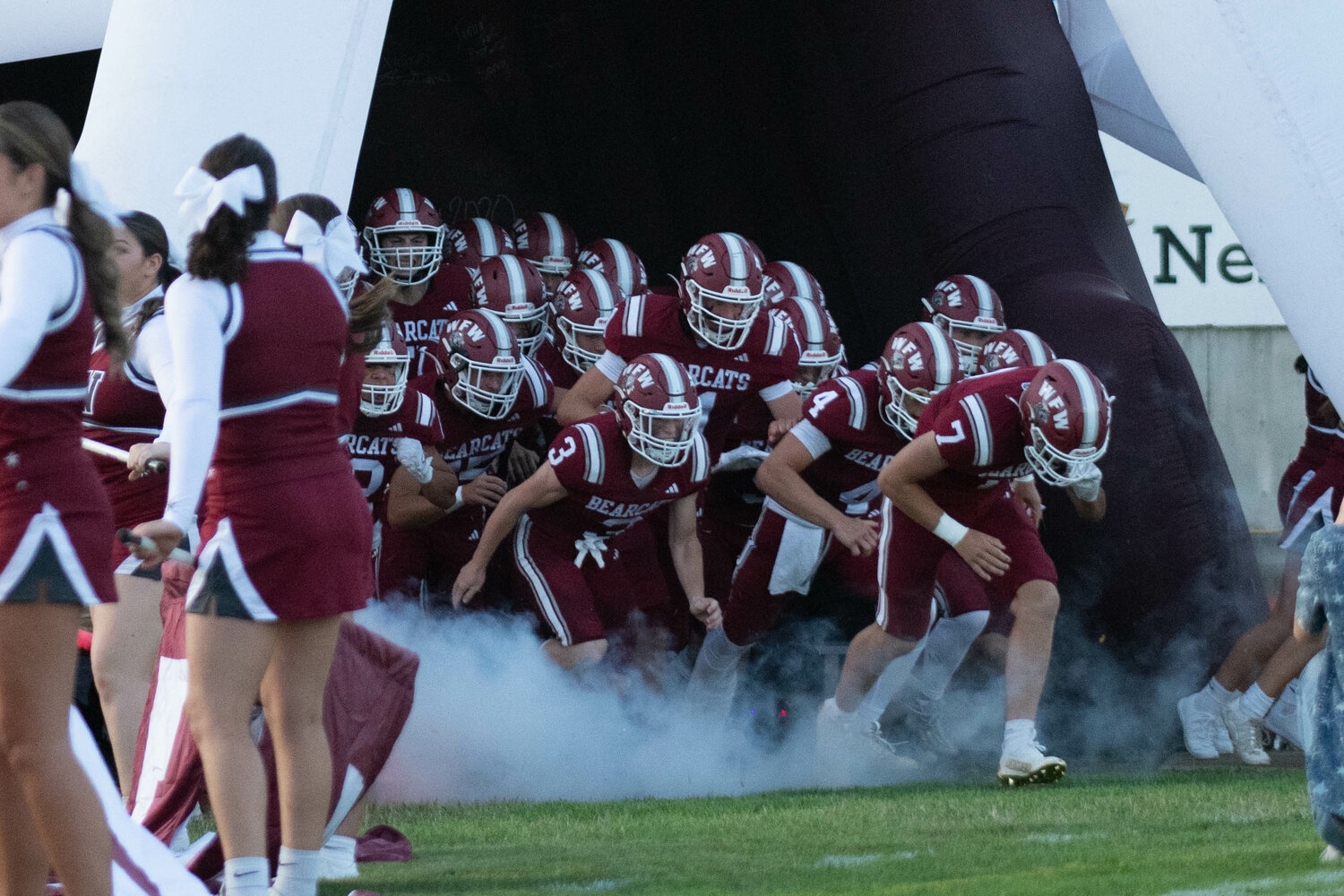 W.F. West players run onto the field before their game against Ridgefield on Sept. 1, 2023.