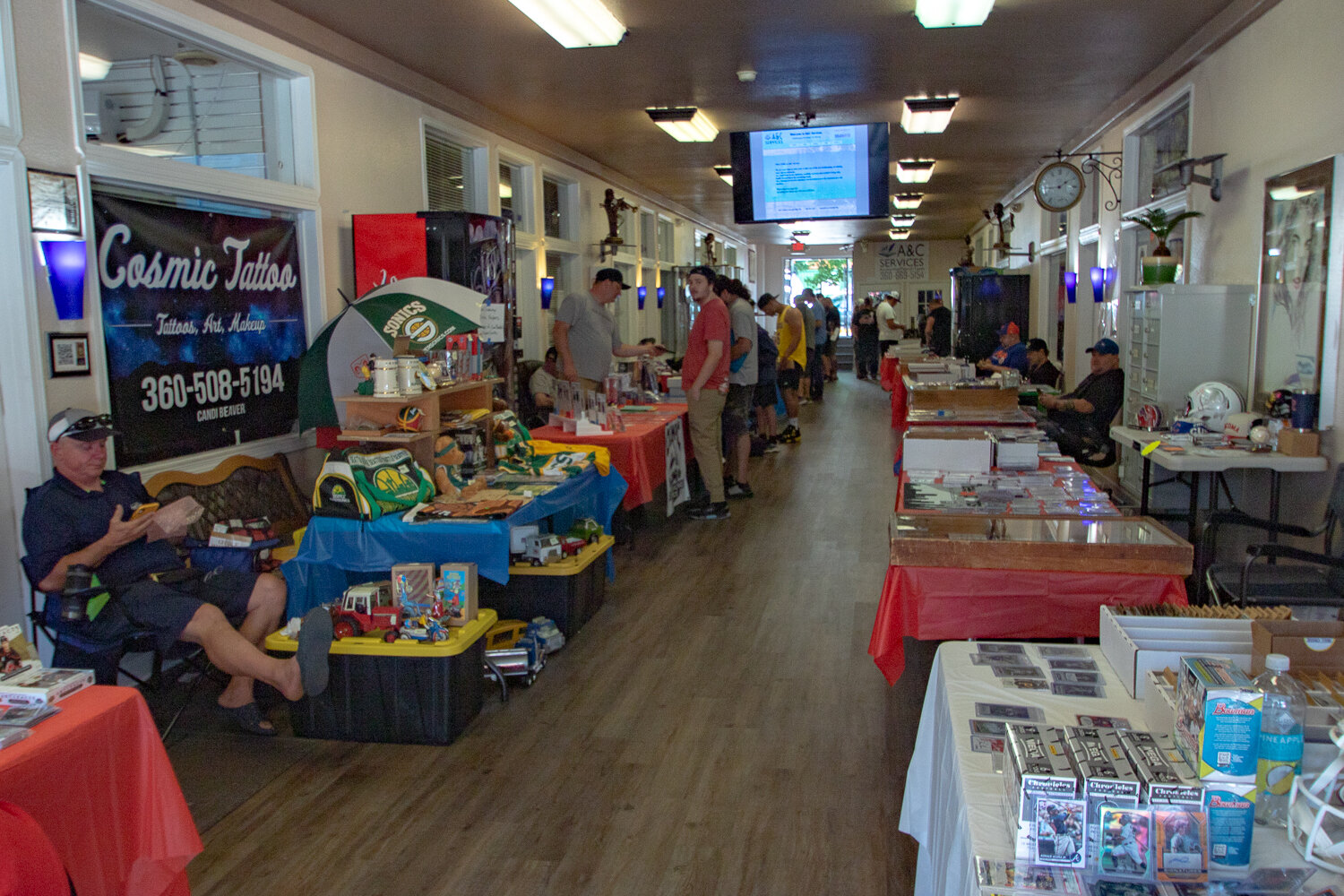 Visitors browse vendors' selections of sports and trading cards, sports memorabilia and other collectables at the first Keiper's Card and Memorabilia Show on Saturday, Sept. 2 inside the Tower Mall at 320 N. Tower Ave. in Centralia.