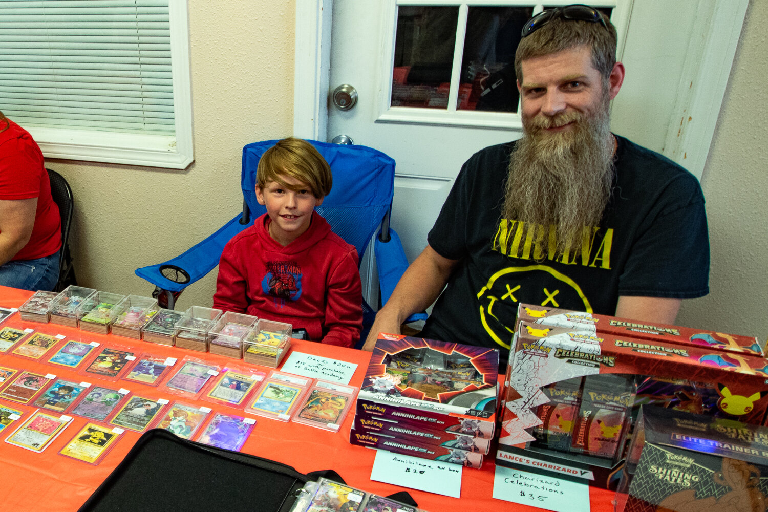 From right, Travis and Jackson Gardner, of Chehalis, sit behind their table selling Pokémon cards at the inaugural Keiper's Cards and Memorabilia Show on Sept. 2.