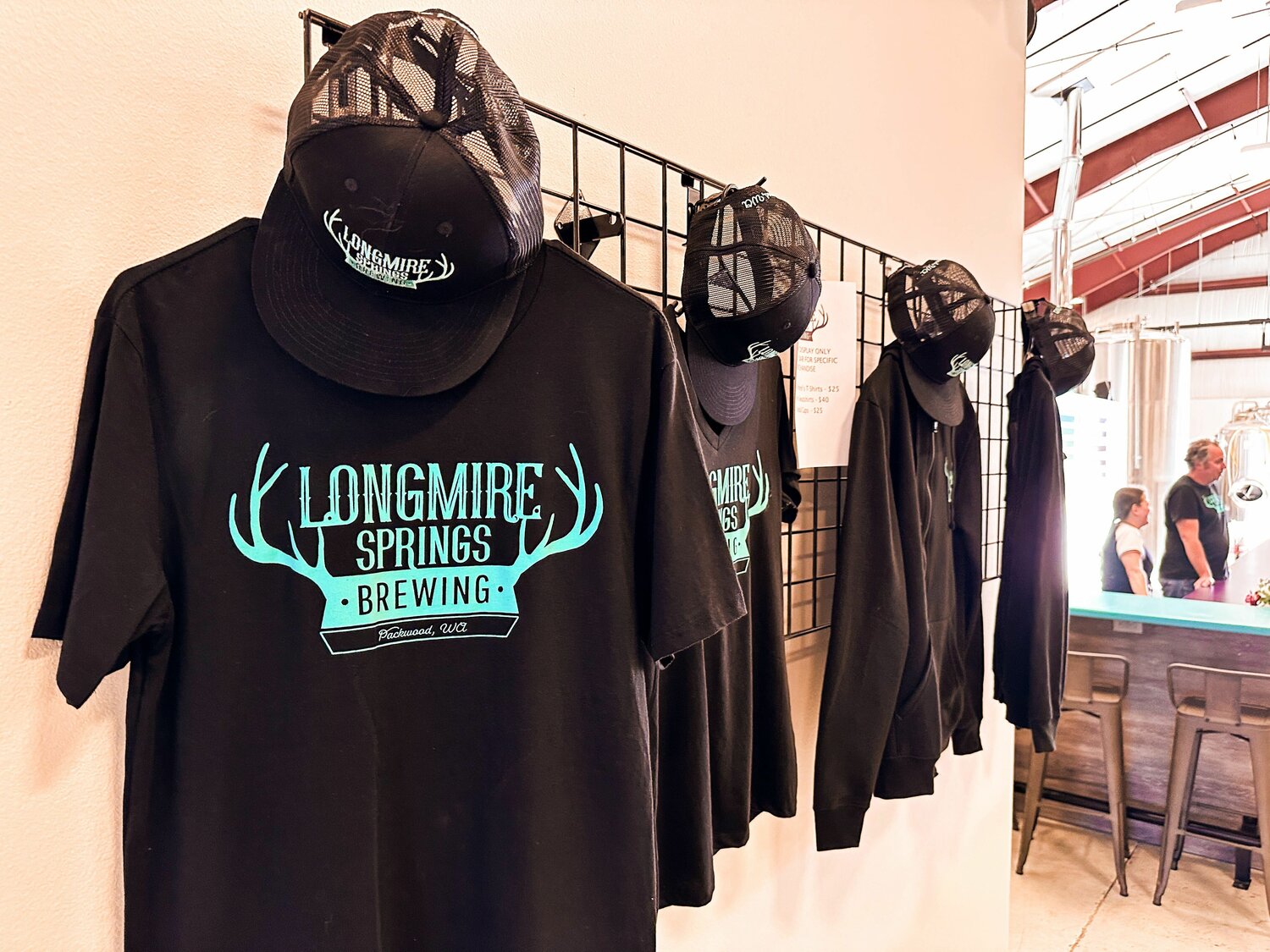 Longmire Springs Brewing merchandise hangs on display in Packwood on Thursday, Aug. 10.