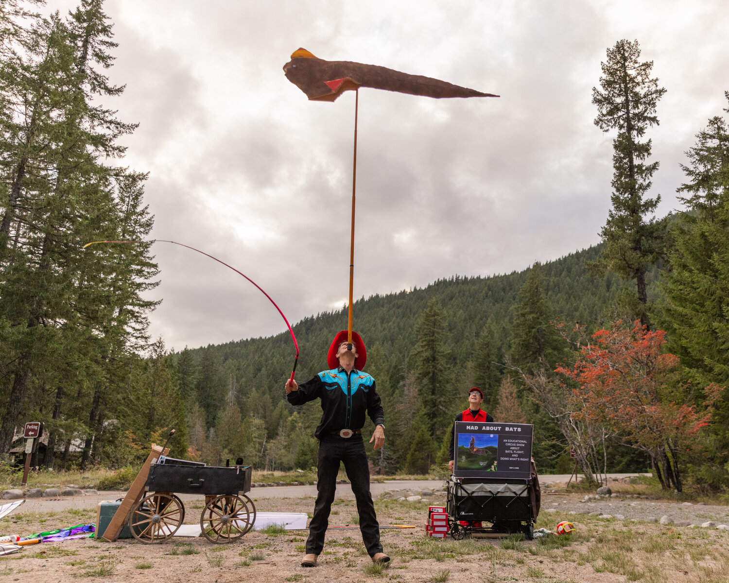 David Lichtenstein shows the size of a pterosaur, the largest flying creature to ever exist, during a Vaudeville-esque show at Mount Rainier National Park on Tuesday, Sept. 12.