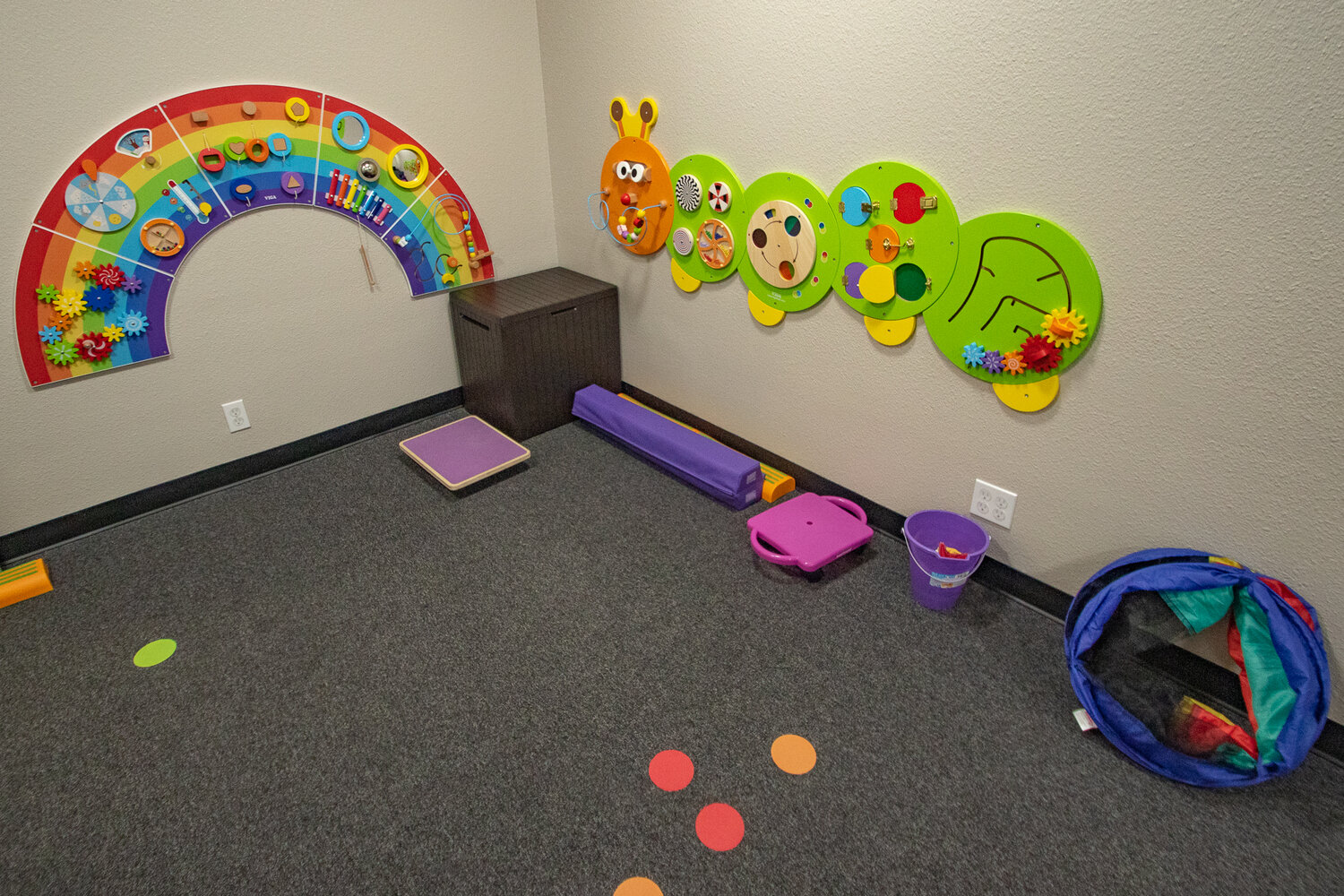 Children's toys are seen mounted on the walls of a therapy room on Friday, Sept. 8 at the Cornerstone Center for Development which offers speech, occupational and physical therapies to parents with children who have autism or other disabilities