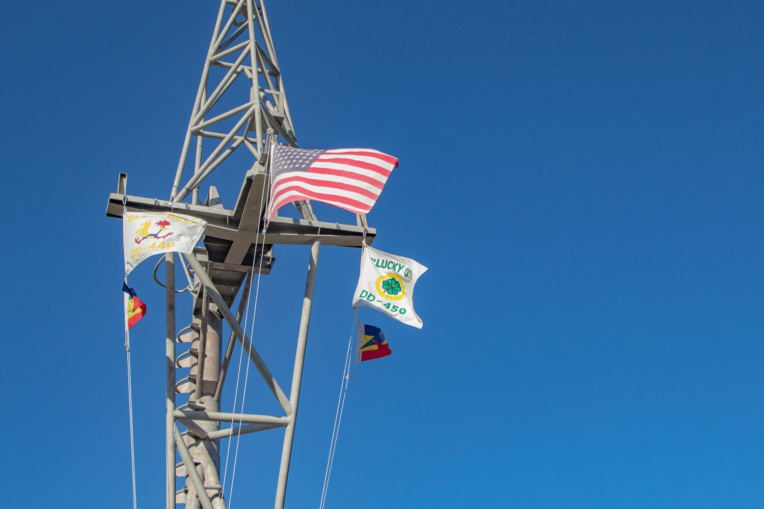 The flags of the USS Nicholas, DD-449, and the USS O'Bannon, DD-250, are seen flying on Thursday, Sept. 14, on top of the Nicholas' mast which is now displayed in front of the Veterans Memorial Museum in Chehalis.