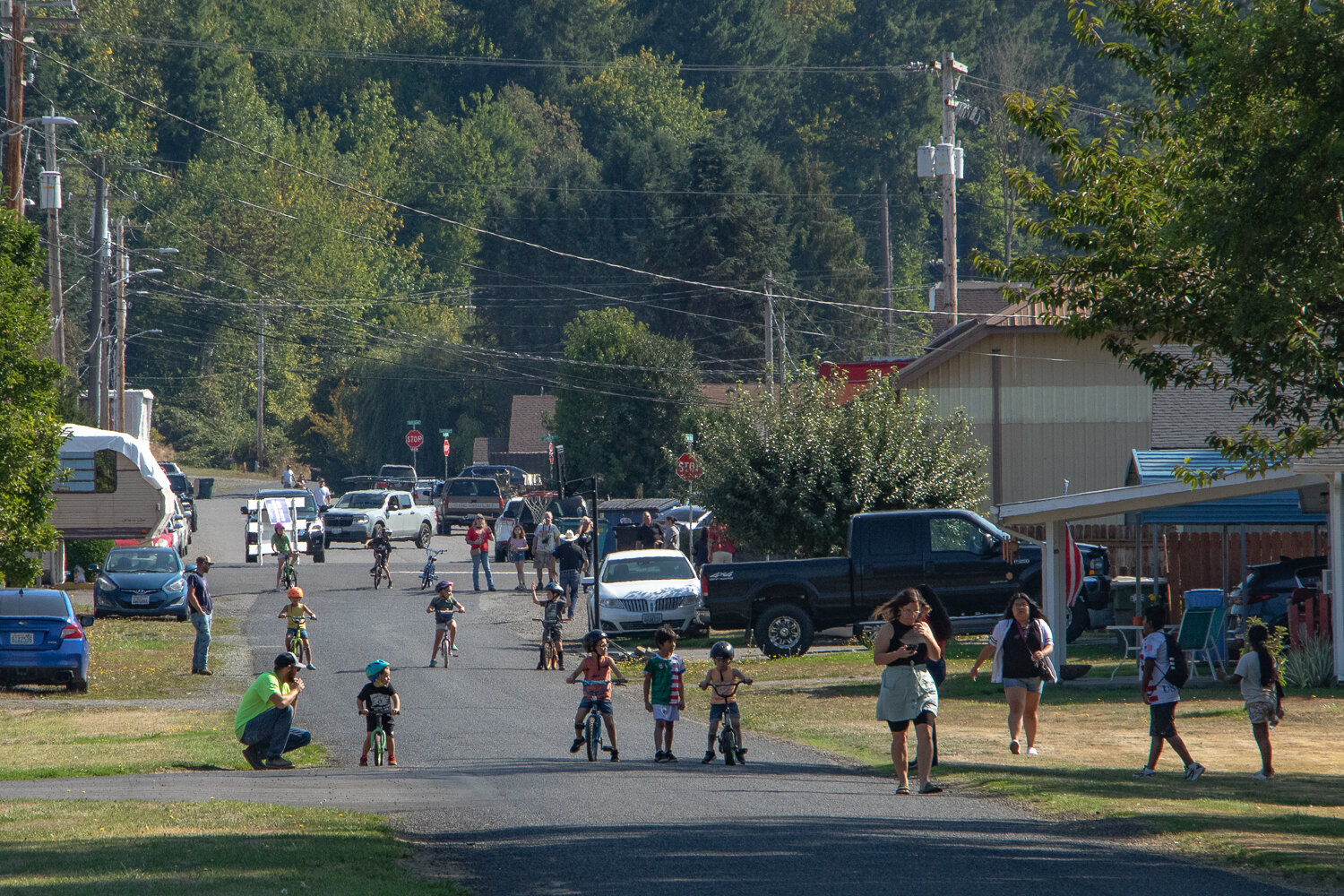 Parents prepare their children to participate in the bike races down West Main Street in Mossyrock kicking off the city's Mexican Independence Day celebration on Saturday, Sept. 16.