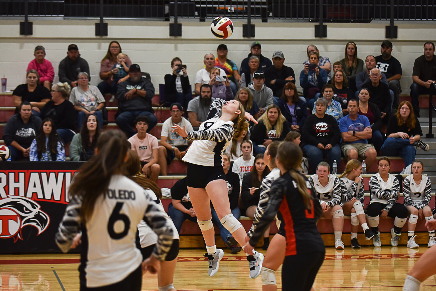 Alexis Young rises up to send the ball over the net during Toledo's match against Rainier on Sept. 19.