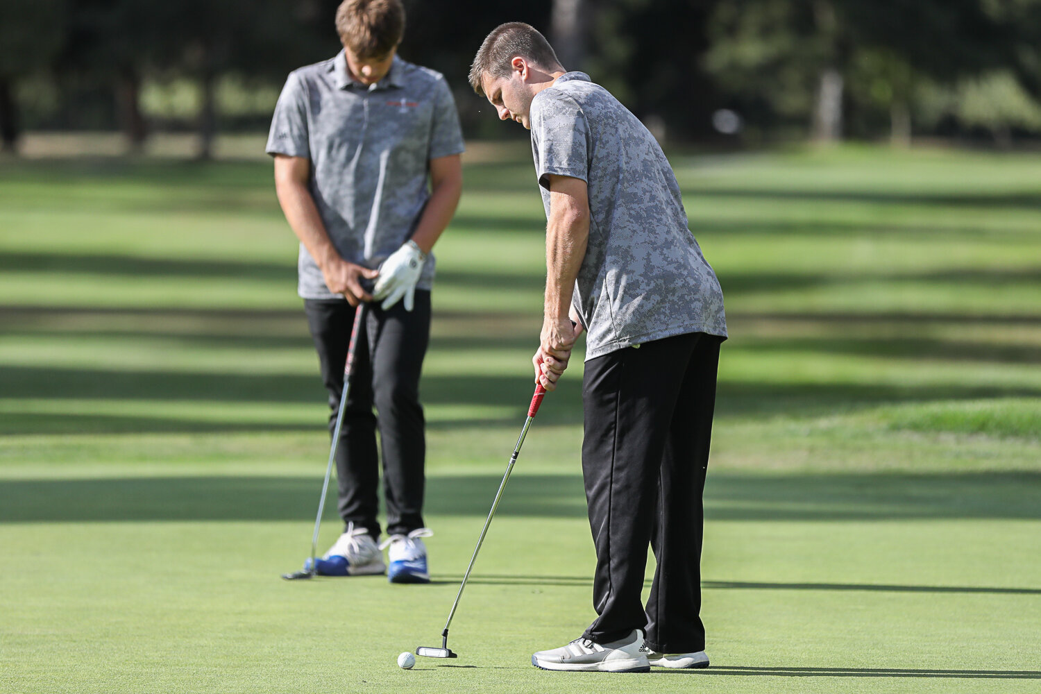 Centralia's Brady Sprague putts the ball during the Tigers' meetup with W.F. West at Riverside Golf Course on Sept. 20.