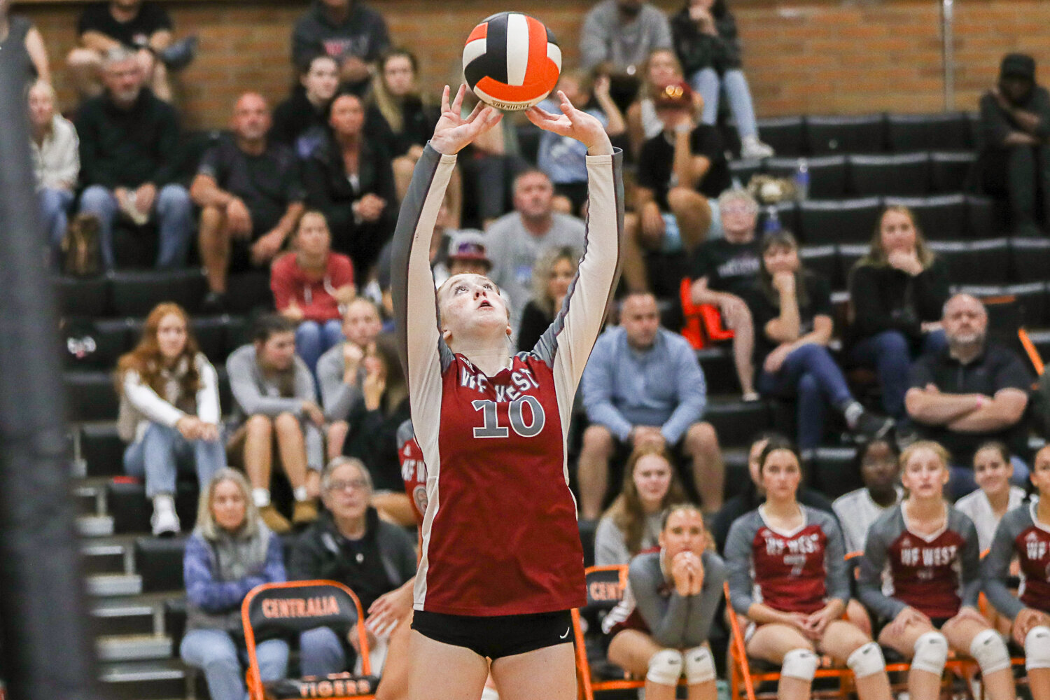Ashley Mueller sets the ball during the first set of W.F. West's loss at Centralia on Sept. 21.