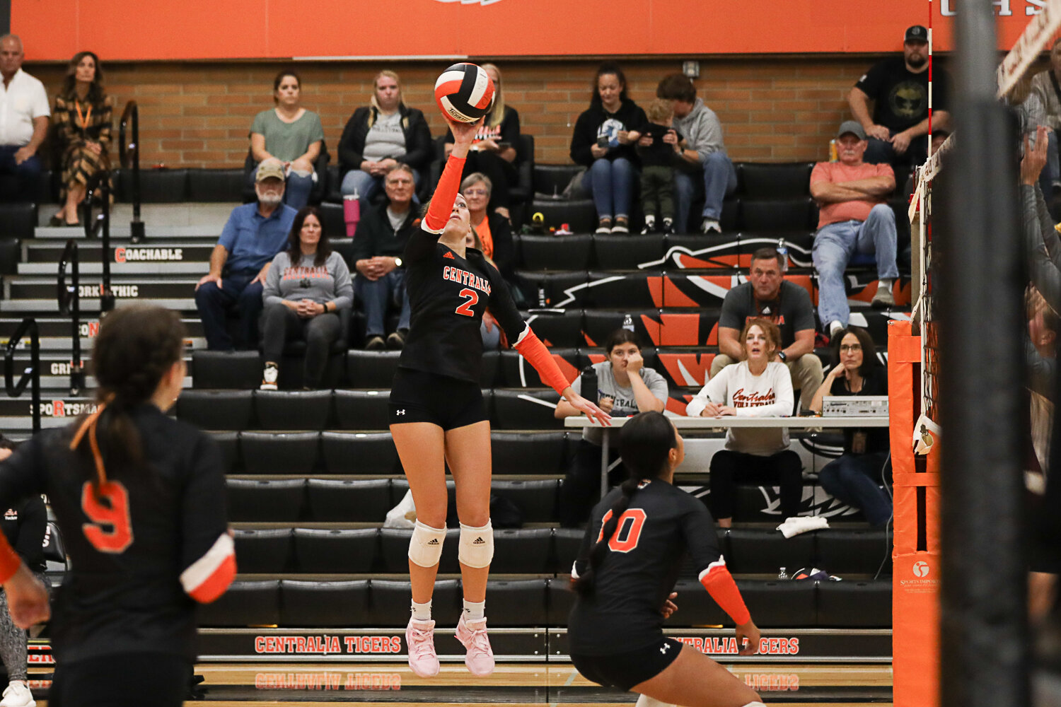 Lauren Wasson tips the ball over the net during the first set of Centralia's three-set win over W.F. West on Sept. 21.