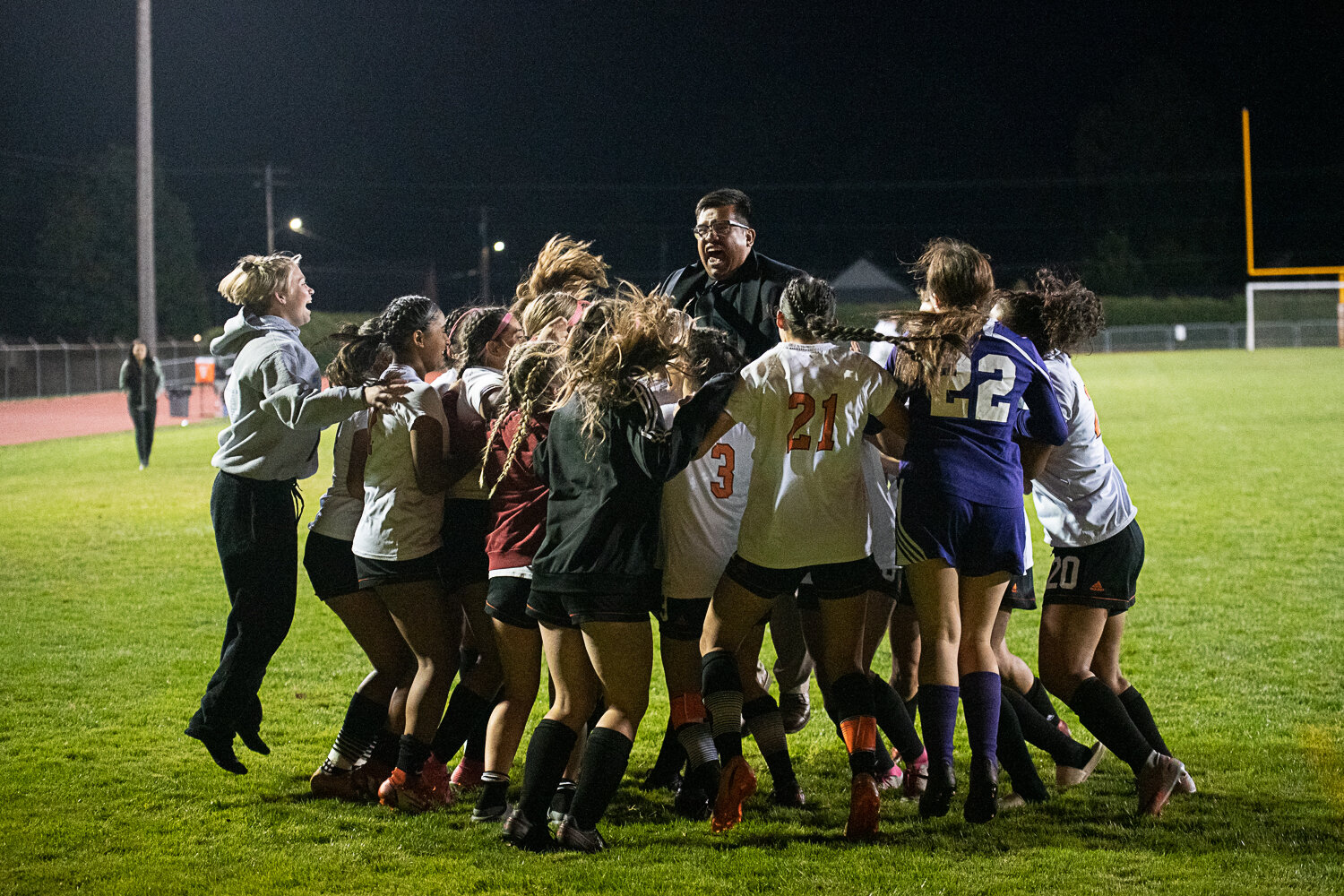 Coach Luis Magana Reyna and the Tigers celebrate after defeating W.F. West in a shootout on Sept. 21.