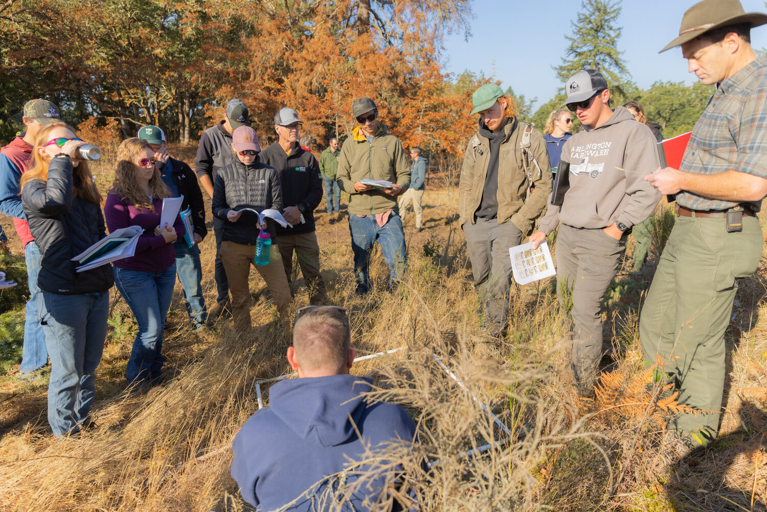 Visitors at West Rocky Prairie participate in training for prescribed burning near Tenino on Thursday, Sept. 21.