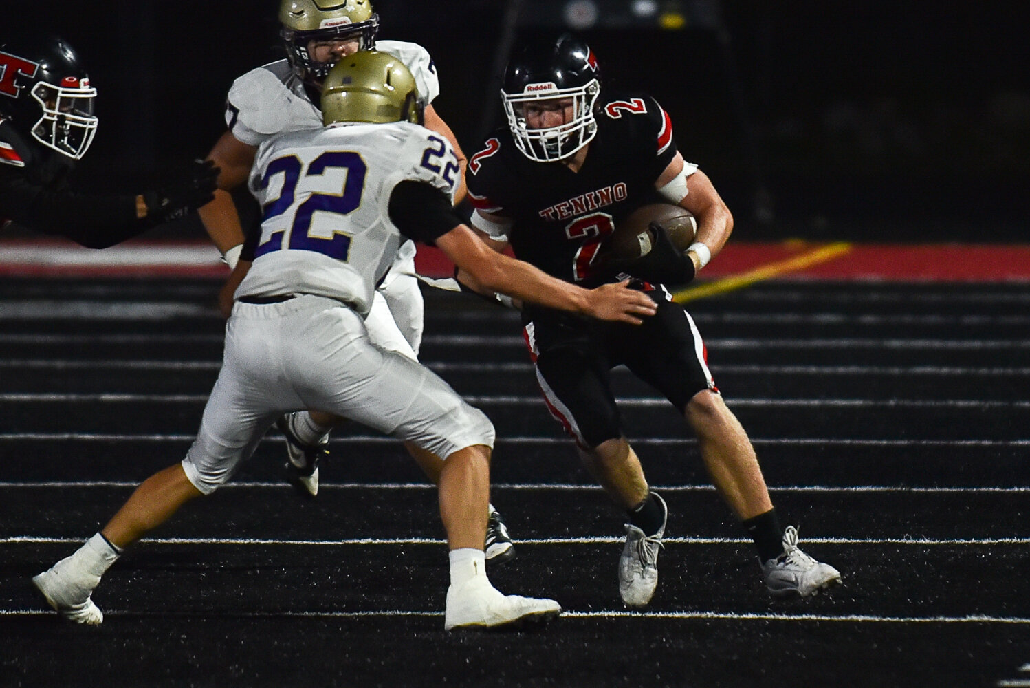 Tenino's Austin Gonia looks to run through an Ony defender in their 62-21 loss on Sept. 22.
