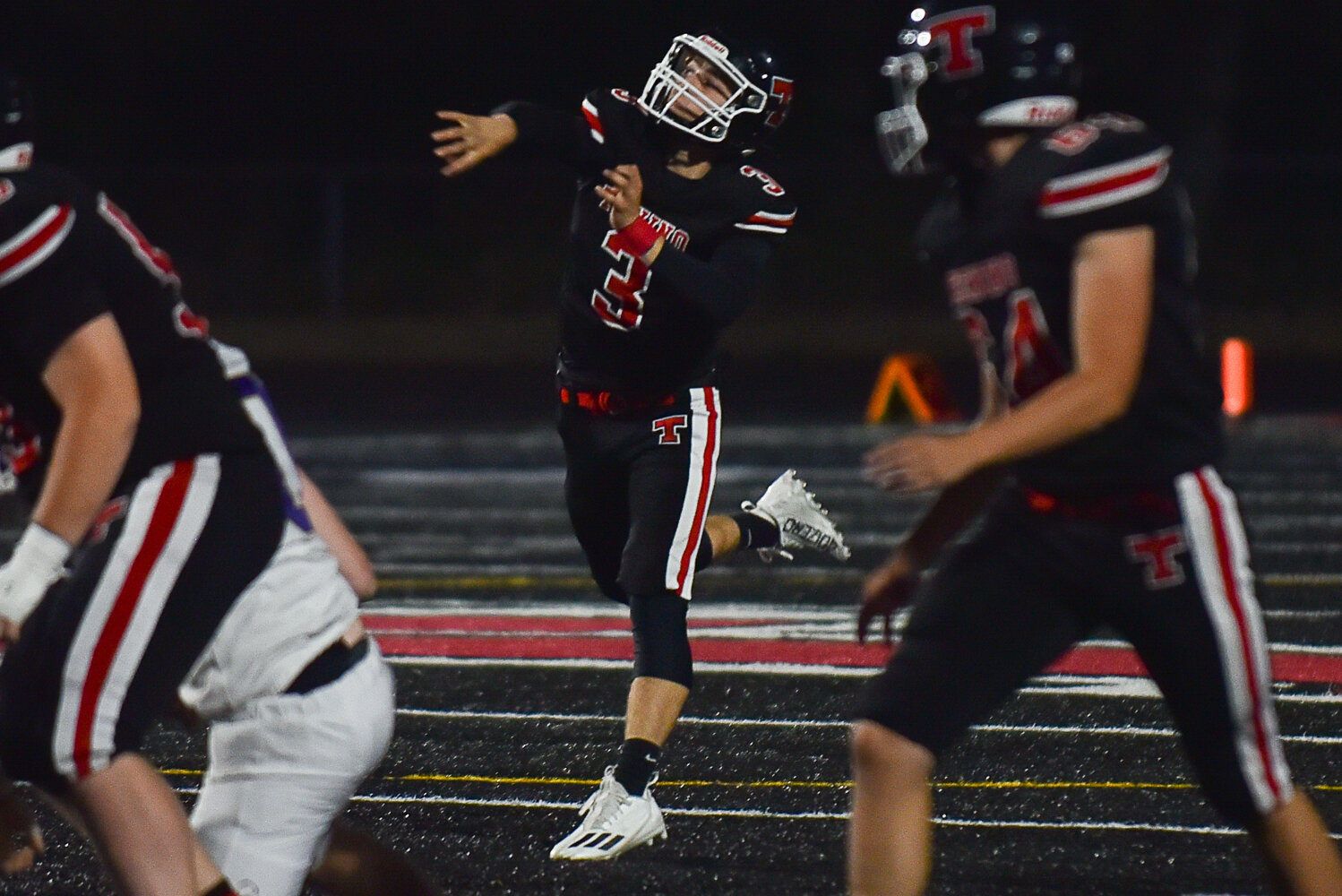 Tenino's Cody Strawn targets a receiver downfield during a 62-21 loss to Onalaska on Sept. 22.