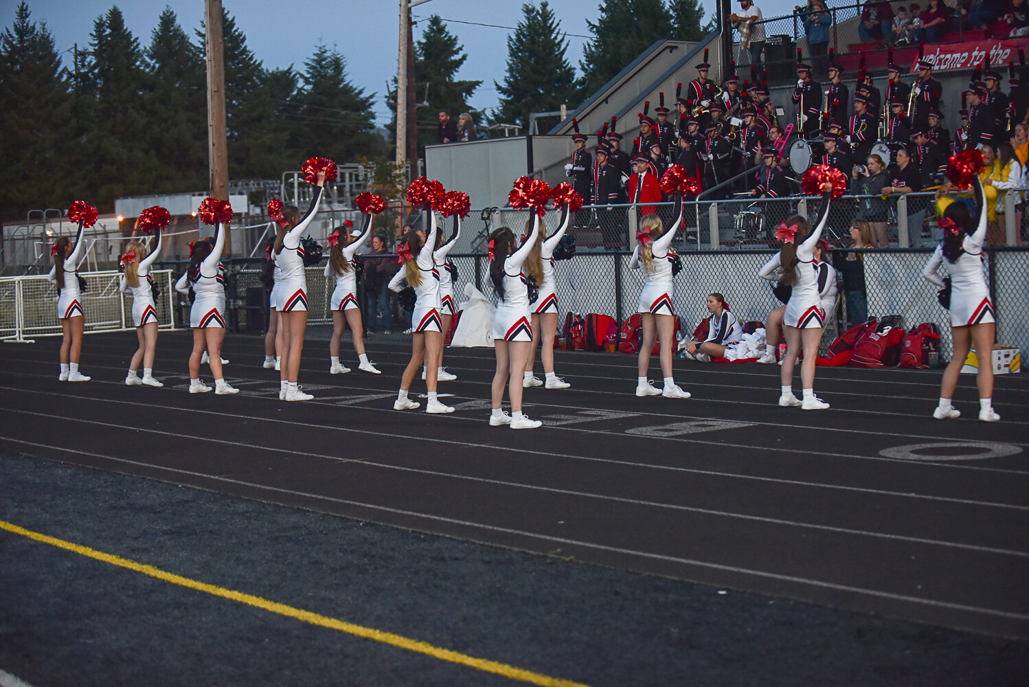 The Tenino cheer team looks to hype up the crowd during Tenino's game against Onalaska on Sept. 22.