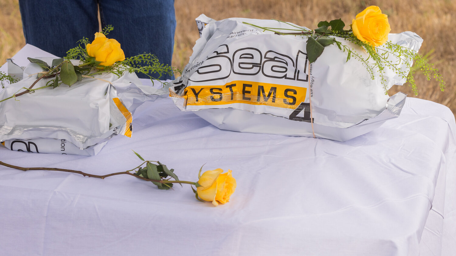 Flowers sit on unclaimed remains during a ceremony in Chehalis on Thursday, Sept. 28.